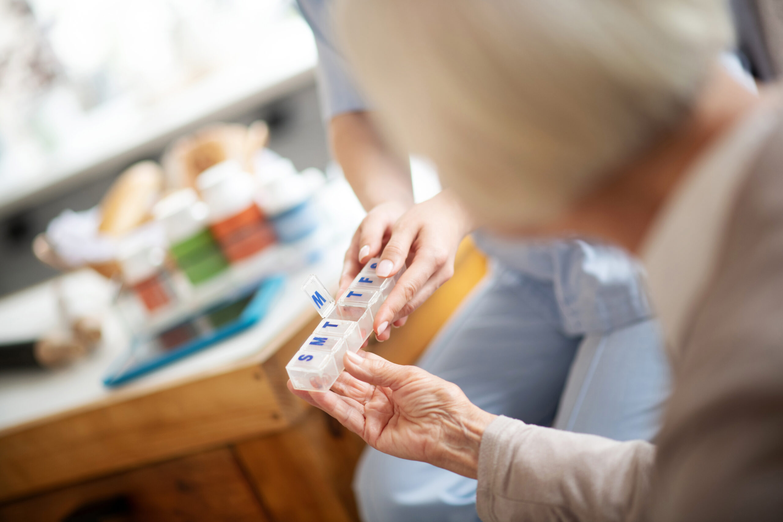 Aged woman taking pills while having rehabilitation period